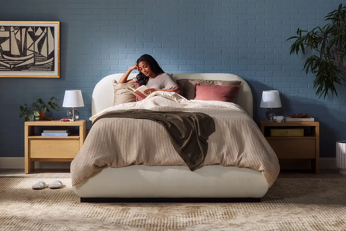 Woman Reading In Bed.width 1200